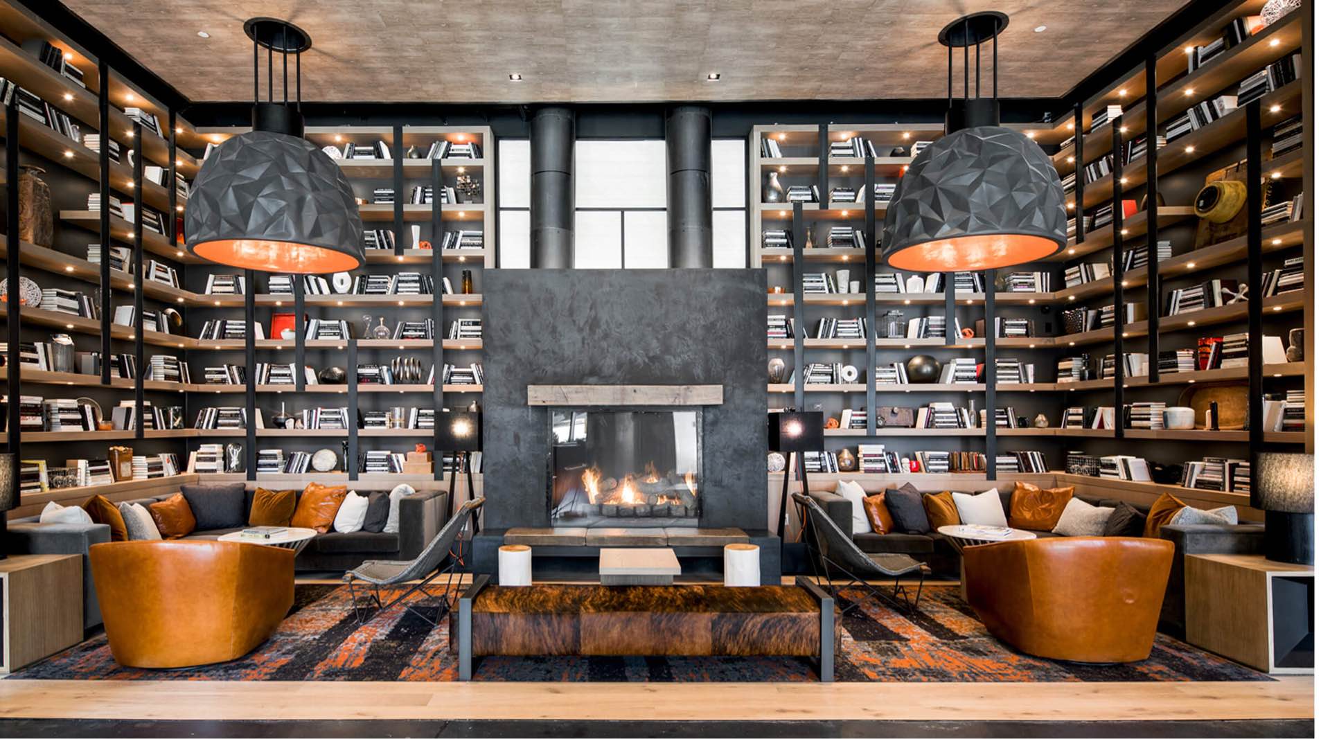 Well lit Library with a comfortable lounge and tall book shelves